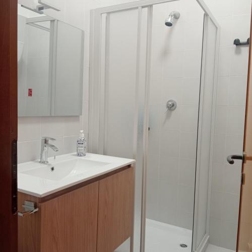 a bathroom with a sink and a shower at La Perla sul Trasimeno in San Feliciano