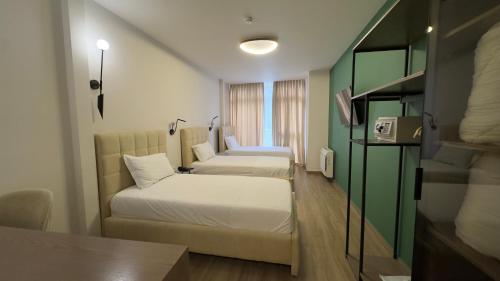 OLIA Residence 객실 침대