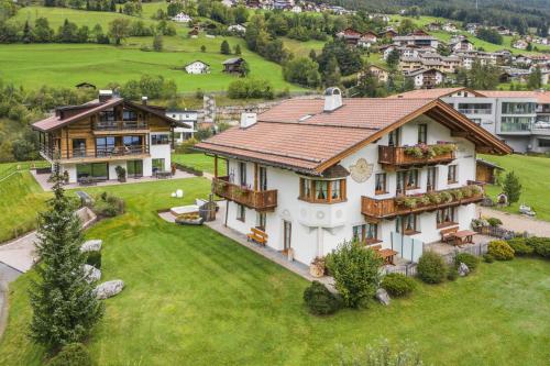 an aerial view of a house with a yard at Chalet Bel Plan in Ortisei