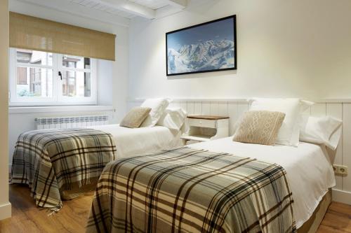 Voodi või voodid majutusasutuse Val de Ruda Luxe 36 by FeelFree Rentals toas