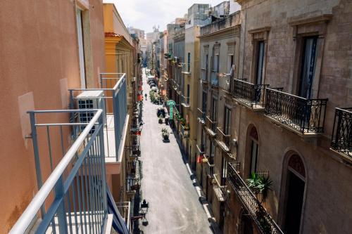 a view of an alley between two buildings at HARBOR BREEZE Trapani in Trapani