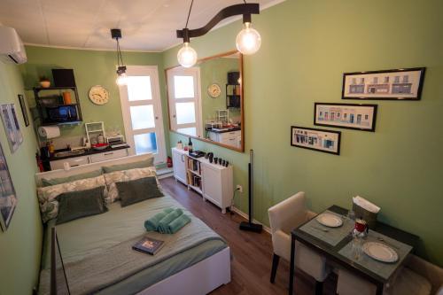 a room with a bed and a table in it at Minicasa Il Salone di Gino in Potenza