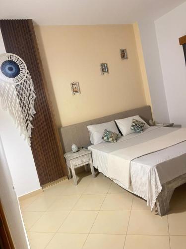 a bedroom with a bed and a table in it at Casablanca1 in Dahab
