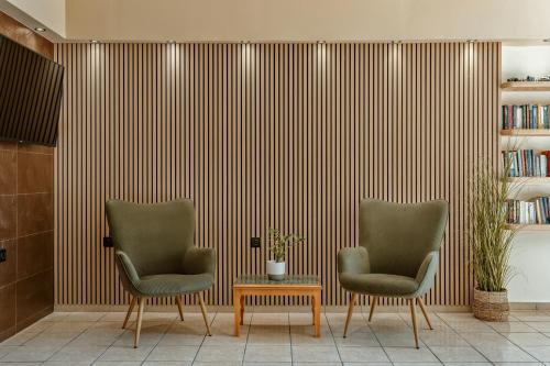 two chairs and a table in a room at Varvara's Diamond - Adults Only in Platanes