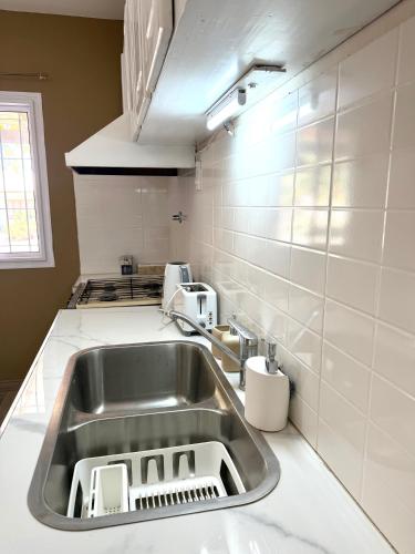 a kitchen with a stainless steel sink in a kitchen at Sol de Alvear in General Alvear