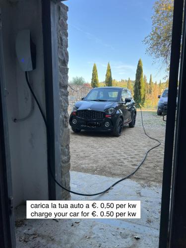 a car is parked in a driveway at Villetta Gabriella in Impruneta