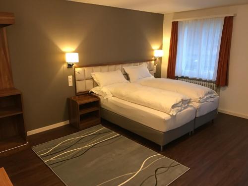 
Ein Bett oder Betten in einem Zimmer der Unterkunft Falken am Rotsee
