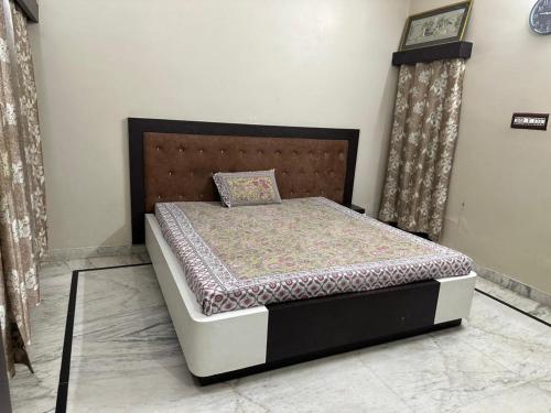 a bed sitting in a room with at Dj's home stay in Jodhpur