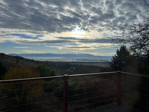 a view of a valley under a cloudy sky at A frame Miška in Nána