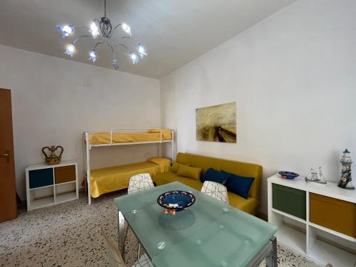 a living room with a couch and a table at La casa del professore libeccio in Nicotera Marina