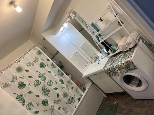 a small bathroom with a toilet and a sink at Patty Home Stay in Carrières-sous-Poissy