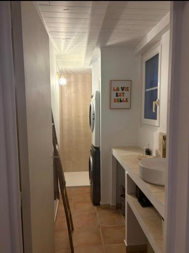 a bathroom with a sink and a toilet in it at Villa la serella in Brando