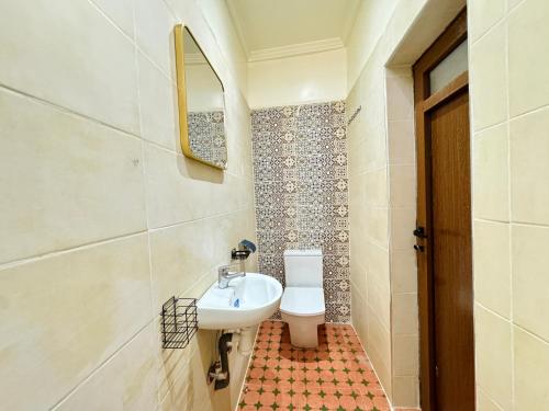 a bathroom with a sink and a toilet at Marrakech ferme lodge in Marrakesh