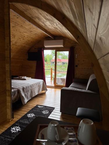 a small room with a bed and a window at Floating Dream in Fiano