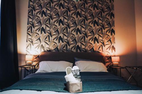 a bedroom with a bed with a large headboard at Portico Provenzali in Cento