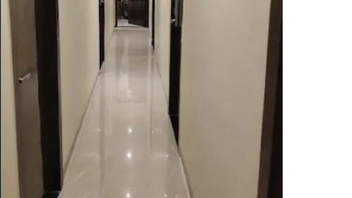 a hallway with a glass floor in a building at FabHotel BD Colaba in Mumbai