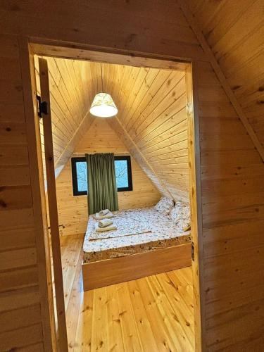 an inside view of a room in a log cabin at Sisters House in Borjomi