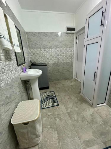 a bathroom with a sink and a toilet and a shower at Serenity villa in Pointe aux Biches