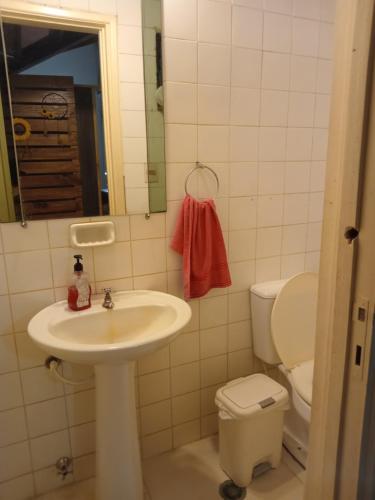 a bathroom with a sink and a toilet at Departamento Luque in Luque