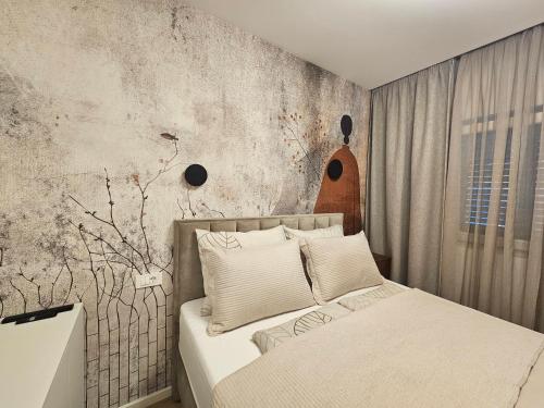 a bedroom with a bed and a concrete wall at Brand New seaside Apartments NOA & JAKOV, Zaboric Sibenik in Zaboric