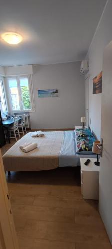 a bedroom with a large bed and a table at Modena Private Room in Modena