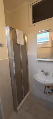 a bathroom with a shower and a sink at Modena Private Room in Modena