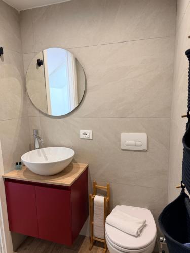 a bathroom with a sink and a mirror at Casetta Velia in Gaeta