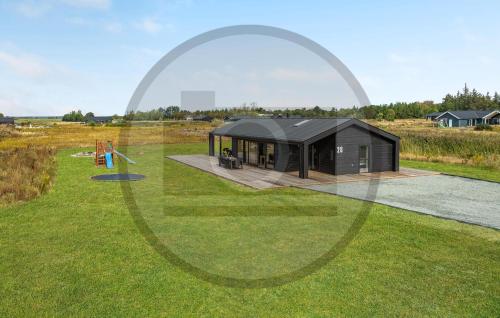 a rendering of a black house in a field at Awesome Home In Jerup With Sauna in Jerup