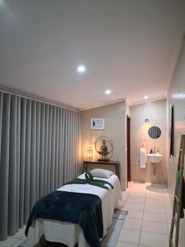 a bedroom with a large bed in a room at Colina de Picoutos Moradia com piscina in Póvoa de Lanhoso