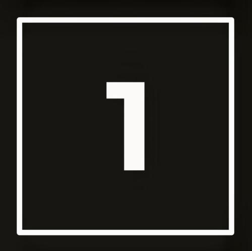 a white square with a number one on it at KWADRAT hostel in Roztworowo