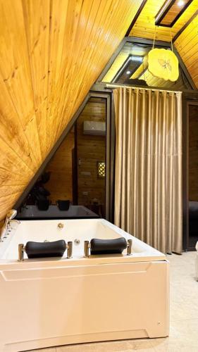 a large white box sitting in a room at Al Joud Chalet Private Jacuzzi & BBQ Ajloun in Ajloun