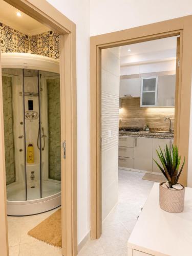 a large bathroom with a shower and a sink at Modern Comfort Stay Tanger in Tangier