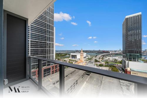 a view of a city from the balcony of a building at Walking Distance from Bayside Market Place - 501 First Residences Junior Studio Rooftop Pool in Miami