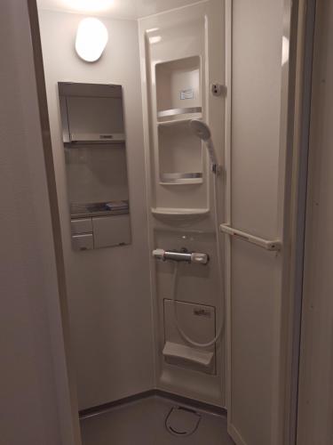 a bathroom with an empty refrigerator with its door open at StadtLeben東北ゲートウエイ2新築広々仙台駅徒歩5分 in Sendai