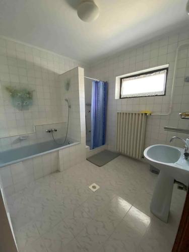 a bathroom with a shower and a sink and a tub at Apartment Gyenesdias 3 in Gyenesdiás