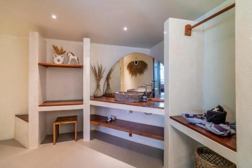 a bathroom with a sink and a mirror at MELO Gili Air in Gili Islands