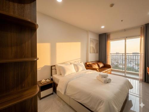 a hotel room with a bed and a window at Luxumiere Apartment with Resort Pool - Elite Gym in Ho Chi Minh City