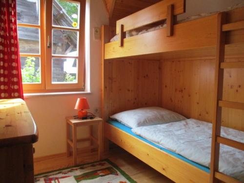 Tempat tidur dalam kamar di Apartments Berghof Familie Steinwender