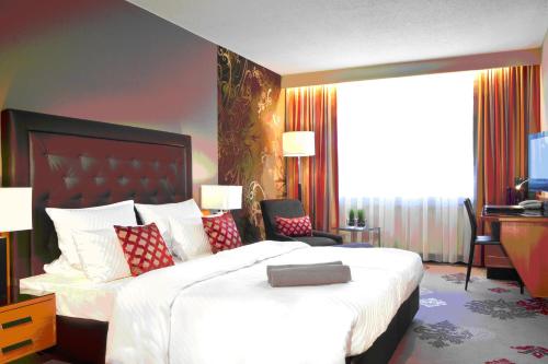 Katil atau katil-katil dalam bilik di DER HEIDEHOF Conference & SPA Resort