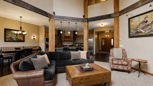 a living room with a couch and a table at BOTHR Steelhead in McCall