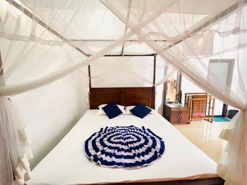 a bedroom with a bed in a tent at Mount Top in Dickwella