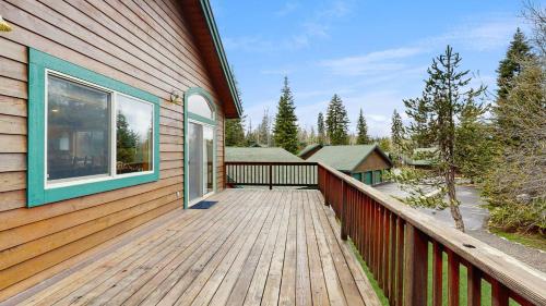 a wooden deck on the side of a house at Spring Mountain Condo Pool Gym Slopes in McCall