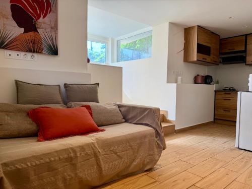 a living room with a couch and a kitchen at Marina in Aghia Marina