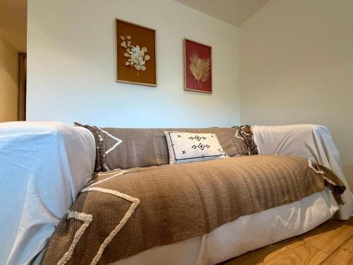 a couch with a blanket on it in a room at Marina in Aghia Marina
