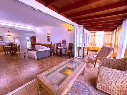 a living room with a couch and a table at Tropicalidays Oceanview Chayofa in Chayofa