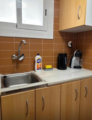 a kitchen with a sink and a counter top at Apartamento Tossa in Tossa de Mar