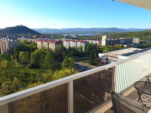 a balcony with a view of a city at Apartmán s balkonem in Most