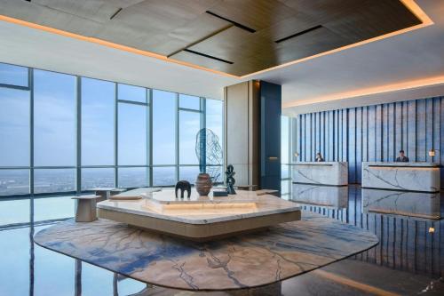 a large room with a bath tub with a view at Huzhou Marriott Hotel Nanxun in Huzhou