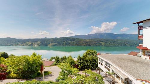 a view of a lake from a building at Hotel Alexanderhof in Millstatt