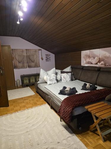 a room with a bed and a couch in it at Ferienwohnung Köck in Sankt Georgen bei Neumarkt